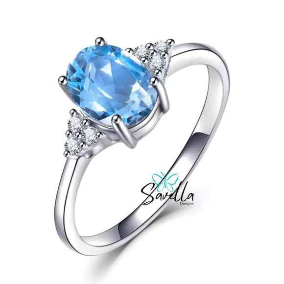 Blue Topaz Ring set in Solid Sterling Silver with Lab Created Accent Diamonds. - Picture 1 of 1